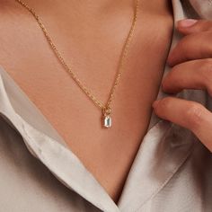 A dainty stone and delicate metallic chain are combined to create this Gold Pendant Necklace in stellar moissanite, your new favorite wear-anywhere accessory.   The birthstone for the month of April is Diamond. Moissanite is referred to as a Diamond simulant. Moissanite disperses light very well and has higher light refraction than Diamond and will appear more brilliant.  Lab-created moissanite stone; Made of 14K gold plated sterling silver.  Pendant size: 4mm x 6mm with 18" chain.   Hypoallerge Gold Birthstone Necklace, April Birthstone Necklace, Light Refraction, Birthstone Charm Necklace, September Birthstone Jewelry, Moissanite Necklace, August Birthstone Jewelry, July Birthstone Jewelry, April Birthstone