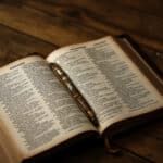 an open book sitting on top of a wooden table