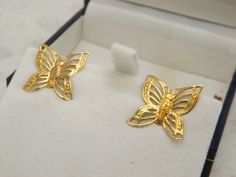 Hello and welcome to my shop. I am offering to you this lovely pair of filigree butterfly design costume jewelry pierced earrings. As you will see in the pictures they are made in an open wing butterfly design in goldtone metal. The poles and butterfly fastners are both in a very good working order.   The filigree goldtone butterfly stud earrings are in an excellent used vintage carefully cleaned condition with only slight age related surface wear to backs as shown. So please see my five pictures as are part of my description of the details of the size, colours, design and general condition of these lovely elegant pieces. Thanks. The earrings are unmarked.   See picture five for size details. I am always happy to combine postage on multiple sales Gold Earrings With Butterfly Charm For Formal Events, Gold Earrings With Butterfly Charm For Formal Occasion, Gold Butterfly Earrings For Formal Occasions, Gold Butterfly Earrings For Wedding, Gold Butterfly-shaped Pierced Earrings, Wing Butterfly, Butterfly Stud Earrings, Butterfly Earrings Stud, Filigree Design