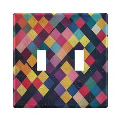 a multicolored switch plate cover with two toggles