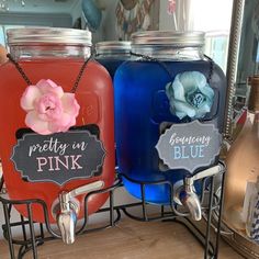 three different colored jars with chalkboard labels on them