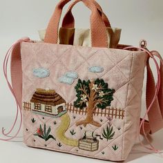 Quilted textile velvet bag in a delicate pink color. The bag is very pleasant to the touch, soft, but structured, keeps its shape. The bag is decorated with original handmade embroidery on a household theme. Bag dimensions: width 20 cm height 20 cm depth 10 cm The bag is lined, has short handles and a long strap that allows you to carry the bag over your shoulder. Inside the bag there is a pocket that closes with cords. The bag is made of 100% cotton. If you wish, you can choose a different fabric color and change the embroidery style. Any individual changes, depending on their complexity, may affect the final cost of the bag. This aspect will be discussed with the manager during the negotiations. Recommended care: dry cleaning Square Bucket Bag With Dust Bag As Gift, Trendy Handmade Bags As Gifts, Pink Rectangular Bucket Bag As Gift, Pink Rectangular Bucket Bag For Gift, Trendy Handmade Bag For Daily Use, Trendy Handmade Bags For Daily Use, Everyday Embroidered Rectangular Bag, Trendy Handmade Pouch Bags, Embroidered Canvas Satchel For Daily Use