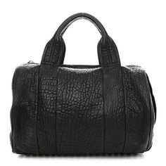 This is an authentic ALEXANDER WANG Pebbled Lambskin Rockie in Black and Nickel Hardware. This stylish bag is crafted of dramatically textured lambskin leather in black. The bag features rolled-leather top handles and nickel hardware including a panel of nickel studs on the base. The top zipper opens to a black fabric interior with zipper and patch pockets. Luxury Black Bags With Grained Texture, Black Pebbled Texture Travel Bag, Designer Evening Bags With Grained Texture, Black Travel Bag With Pebbled Texture, Black Rectangular Bag With Grained Texture, Black Bag With Grained Texture For Everyday Use, Black Rectangular Bag With Pebbled Texture, Black Bags With Grained Texture For Everyday Use, Black Rectangular Bags With Pebbled Texture