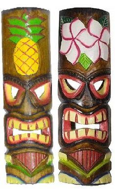 two tiki masks with pineapples and flowers on them