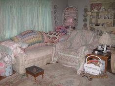 a living room filled with lots of furniture and pillows on top of it's covers