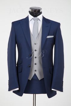 a mannequin wearing a blue suit and white shirt