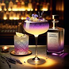 an alcoholic cocktail with lavender and lemon garnish