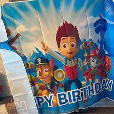 an image of a happy birthday banner with paw patrol characters on the front and back