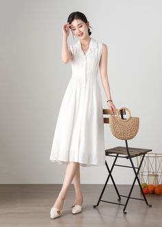 "Cool and comfortable for hot summer days, this white cotton dress is elegant and stylish.    It is a wonderful wardrobe staple that's a timeless classic you'll wear again and again. Cotton materials, comfortable, breathable, refreshing and soft fabric. All our items are Tailored and Handmade and Made to Order ,I can make Any Size . I design new styles every week, please collect my store. I believe that you will meet your favorite styles. ★★FEATURES Cotton fabric Has lining Front button closure White Midi Dress For Summer Day Out, Cotton Sleeveless Sundress For Summer, Knee-length Sleeveless Cotton Dress For Summer, White Sleeveless Linen Casual Dress, Casual Sleeveless Linen Dress For Spring, Cotton Sleeveless Summer Dress, Casual White Linen Sundress, White Sleeveless Linen Dress, Elegant White Sleeveless Cotton Dress