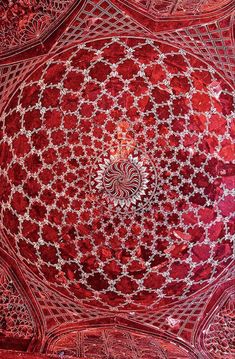 an intricately designed ceiling is shown in red