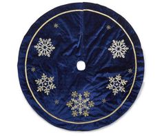 a blue and gold christmas tree skirt with snowflakes on the front, hanging from a hook