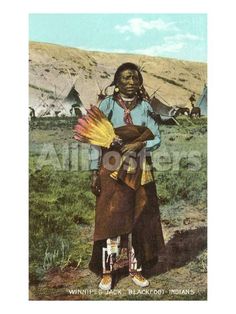 an old photo of a native american woman holding flowers in her hands and standing on the ground