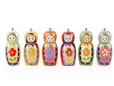 a row of colorful nesting dolls sitting next to each other