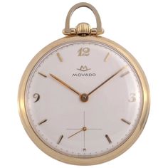 Vintage Swiss Movado open face 14K pocket watch, circa 1940. This vintage pocket watch by Movado is crafted in 14 karat yellow gold. The Movado pocket watch features the original silvered dial and a 17 jewel manual movement. Case #4876062. Warranty This watch comes with a full 18 month warranty from the date of purchase. Timeless Compact Pocket Watch For Formal Occasions, Self-winding Yellow Gold Pocket Watch With Round Dial, Self-winding Yellow Gold Pocket Watch, Timeless Self-winding Pocket Watch With Round Dial, Timeless Self-winding Pocket Watch For Formal Occasions, Timeless Self-winding Pocket Watch For Formal Events, Classic Formal Compact Pocket Watch, Classic Yellow Gold Pocket Watch With Round Dial, Timeless Compact Pocket Watch With Chronometer