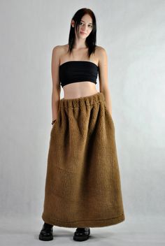 This is our no. 131 of Conscious Clothing Concept. This is a long maxi sheep's wool skirt that will keep you warm during the coming cold winter.  The pockets are placed in the side seams so you can keep your hands warm as well. It is the ultimate warm fabric for cold weather as it breathes and not allows body to sweat. Please be aware that this skirt will not look slimming :) Please write me a note if you would like any other colour from our fabric options, using a number or a name of a colour o Brown Full-length Maxi Skirt For Fall, Brown Full Length Maxi Skirt For Fall, Fall Full Length Brown Maxi Skirt, Brown Lined Skirt For Winter, Brown Long Skirt Bottoms For Winter, Baggy Wide Leg Maxi Skirt For Fall, Brown Long Skirt For Winter, Winter Brown Lined Skirt, Winter Full Maxi Skirt With Pockets