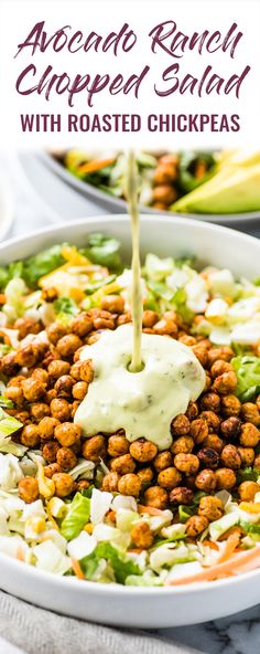 the dressing is being poured into a salad with roasted chickpeas and avocado ranch