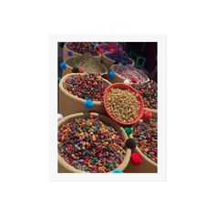 several bowls filled with different types of cereals and sprinkles on top of each other