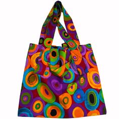 This beautiful shoulder bag is crafted from vibrant African fabric, featuring a bold print of African women. The bag has a Rectangular shape and is large, height 18" x 21" in width inches, making it perfect for travel, workwear, formal events, or casual outings. The bag has an open closure and a shoulder strap made of soft cotton material. The bag's exterior is made of high-quality cotton fabric, adorned with multicoloured patterns that give it a unique and eye-catching look. The bag is handcraf Vibrant Multicolor Bags For Everyday Use, Retro Multicolor Hobo Shoulder Bag, Retro Multicolor Tote Hobo Bag, Retro Multicolor Hobo Tote Bag, Vibrant Multicolor Rectangular Bags, Colorful Vibrant Travel Bags, Vibrant Rectangular Travel Bag, Retro Multicolor Tote Shoulder Bag, Vibrant Colorful Shoulder Bag For Everyday Use