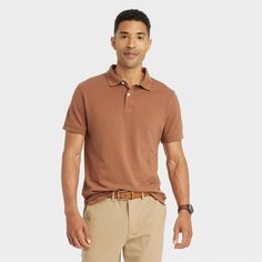 Brown Cotton Polo Shirt With Polo Collar, Fitted Brown Cotton Polo Shirt, Brown Cotton Short Sleeve Polo Shirt, Brown Cotton Polo Shirt, Solid Color Relaxed Fit Polo Shirt With Short Sleeves, Brown Cotton Polo Shirt For Summer, Sporty Short Sleeve Polo Shirt For Work, Casual Brown Polo Shirt With Collared Neckline, Casual Brown Polo Shirt