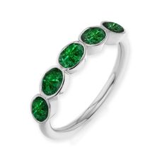 Elegant oval emerald bezel ring with big sparkle. Horizontally set ovals on a round diamond band, make this ring ultra comfortable and virtually snag proof. Perfect for wedding bands, anniversary bands or marking any special life occasion. Set in your choice of 14k or 18k gold. Oval Emerald Diamond Ring With Bezel Setting, Classic Green Oval Stackable Rings, Classic Oval Emerald Ring With Tension Setting, Modern Bezel-set Emerald Ring For Anniversary, Modern Emerald Ring With Bezel Setting For Anniversary, Green Oval Bezel Setting Stackable Rings, Green Oval Stackable Rings With Bezel Setting, Oval Emerald Ring With Tension Setting In Fine Jewelry, Oval Bezel Set Stackable Rings For Anniversary