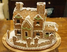 a gingerbread house made to look like it has snow on the roof