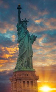 the statue of liberty at sunset in new york city