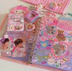 an open planner book with stickers and pictures on it