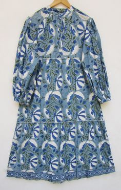 ITEM DESCRIPTION royal blue leaf printed summer bohemian long maxi dress  - collared neckline with buttons maxi dress - long puff sleeve bohemian maxi dress Features : Long sleeve, Collared neck, Long dress Fabric: 100% Soft cotton cambric hand block printed fabric   Sleeve Length: 22 inch  For more sizes & their measurement, please refer our below chart to understand the sizes variations available with us For your size requirement, please mention your size in seller note at the time of buying. IMPORTANT NOTE: - SIZE MEASUREMENT AND CHARTS ARE OF THE ACTUAL GARMENT AND OF THE PERSON WEARING THE GARMENT. BUST MEASUREMENT IS PROVIDED IN INCH ALL AROUND FROM ARMPIT TO ARMPIT OF THE GARMENT. SIZE MEASUREMENT BUSTLENGTHSHOULDER XXS34 inch48 inch13.5 inch XS36 inch48 inch14 inch S38 inch48 inch1 Button Maxi Dress, Maxi Dress Long, Bohemian Maxi, Bohemian Maxi Dress, Dress Out, Rayon Dress, Block Printing Fabric, Long Puff Sleeves, Long Maxi