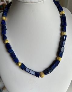 Gemstone jewelry set blue necklace with earrings made of lapis lazuli beads in freeform in different sizes and shapes (e.g.: 8x7x7mm), beveled at the edges, with gold-colored intermediate beads and magnetic clasp. The gold-colored flecks in the lapis that are typical of the stone are clearly visible. The beads are strung on high-quality, tear-resistant and nylon-coated jeweler's wire from German production. Length of the chain 48 cm. The earrings each consist of a lapis, framed by 2 gold beads. Virgo And Aquarius, Lapis Lazuli Necklace, Lapis Lazuli Beads, Bridesmaid Gifts Jewelry, Blue Necklace, Healing Stone, Necklace And Earrings, Magnetic Clasp, Bridesmaids Gifts