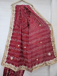 Indian Handmade Gotta Patti Jaipur Bandaj Saree, Unique Design Saree, Multi Color Chunri This Saree Can be used by any women or girl of any age group. Soft feel Saree, Attractive look, Fashion wear. This Saree Style is Traditional Unique and Pretty, add Charm to your dashing look. A beautiful Saree for gift. Item Details: Saree: Pure Georgette Blouse:Pure Georgette Length: 6.5 metres Work: Handmade Gotta Patti Work Care: Please do Dry Wash only. Please don't do Iron at Home. This beautiful handmade gotta patti saree is made of Georgette fabric. This is shop link https://www.etsy.com/in-en/shop/ShreeVishnuCreation Red Chinon Choli For Traditional Ceremonies, Unstitched Red Traditional Wear With Gota Work, Red Chanderi Fabric With Cutdana Embroidery, Red Chanderi Traditional Wear With Cutdana, Red Embroidered Art Silk Fabric With Cutdana, Red Embroidered Saree Fabric For Celebration, Red Chinon Traditional Wear For Ceremonies, Red Traditional Wear For Festive Occasion, Red Traditional Wear With Traditional Drape For Festive