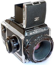 an old style camera with the lens pointed up to it's front and side