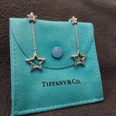 Authentic Tiffany & Co. Sterling Silver Star Dangle Earrings. Never Worn, Excellent Condition. Earring Posts And Backs Are Marked With T&Co 925. Comes With Original Tiffany & Co. Pouch. Elegant Star-shaped Evening Jewelry, Elegant Silver Earrings With Star Charm, Elegant White Gold Earrings With Star Charm, Elegant Star Charm Earrings For Anniversary, Luxury Star-shaped Earrings For Formal Occasions, Luxury Star-shaped Formal Earrings, Star Dangle Earrings, Jewelry Tiffany, Tiffany Earrings