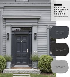 the exterior of a house with gray paint colors and white trim on the front door