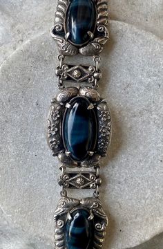 Stunning Blue Tigers Eye Chinese Ornate Sterling Silver Vintage Link Bracelet This bracelet is most amazing ! The stones are incredible, Silver work is stunning ! Solid in weight measures 7 inches in lenght See pictures next to ruler for scale Elegant Blue Oyster Bracelet, Antique Blue Bracelet Jewelry, Vintage Blue Oval Bracelets, Vintage Blue Oval Bracelet, Bohemian Blue Oval Bracelet, Vintage Blue Bracelet For Formal Occasions, Indie Jewelry, Usa Jewelry, Blue Tigers