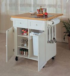 a small kitchen island cart with drawers and utensils