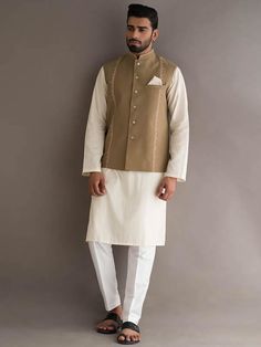 Waistcoat Color: Pale Brown  Waistcoat Fabric: PC Suiting Fabric  Smart looking designer waistcoat features delicate embroidery accent the collar and front  Fancy button closure  Complement with pale aqua kurta and white pajama    Additional Accessories:Peshawari Sandal / Khussa: US$50 Elegant Cotton Nehru Jacket With Chikankari Embroidery, Unstitched Cotton Nehru Jacket For Spring, Traditional Spring Nehru Jacket With Dabka, Spring Wedding Nehru Jacket With Dabka, Elegant Cotton Nehru Jacket For Festive Occasions, Cotton Long Sleeve Outerwear For Eid, Spring Cotton Bandhgala With Dabka, Long Sleeve Cotton Outerwear For Eid, Cotton Nehru Jacket With Dabka And Long Sleeves