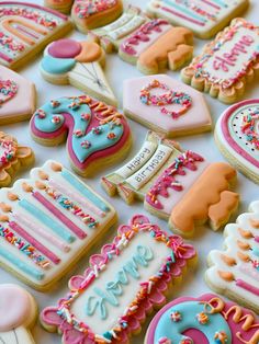 decorated cookies are arranged on a table