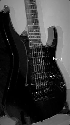 a black and white photo of an electric guitar