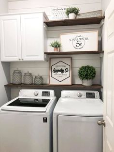 a white washer and dryer sitting in a laundry room next to each other