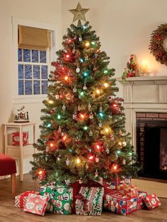 a decorated christmas tree with presents under it