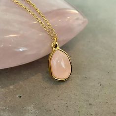 Introducing our new Simple Rose Quartz Necklace! This elegant necklace is made with a high-grade rose quartz gemstone, and is 18k gold plated for a luxurious look. Rose quartz is known as a metaphysical crystal, and it is a symbol of love, peace, and self-care. It's the perfect gift for yourself or a loved one and comes in a beautiful Asana jewelry box. Order now while supplies last!

 

 	Size: 18 inches
 	Free Shipping 2 Days
 	Authentic Pink Stone: Rose Quartz
 	18k Gold Plated Adjustable Gold Rose Quartz Crystal Necklace, Minimalist Rose Quartz Crystal Necklace, Rose Quartz Pendant Necklace With Natural Stones, Minimalist Rose Quartz Pendant Necklace, Rose Quartz Pendant Necklace, Rose Quartz Necklace Pendants, Look Rose, Quartz Pendant Necklace, Stone Rose