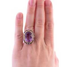 An Art Deco Cocktail Ring Amethyst and Seed Pearls 14K yellow and white gold From the 1920's The ring fits close to a size 6, pulls up about 5.25 on the ring sizer but the back is open behind the amethyst Wear consistent with the age of the piece, some enamel is chipped but otherwise in good condition 6.5 grams 14k Gold Amethyst Ring Art Deco Style, 14k Gold Art Deco Amethyst Ring, Art Deco Hallmarked Amethyst Ring, Collectible Art Deco Amethyst Rings, Art Deco Cocktail, Amethyst Cocktail Ring, Seed Pearl, Ring Sizer, Ring Fit