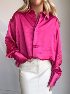 The softest washed satin in a hot pink button up featuring an oversized fit and extra length in the back. This polished button-up is crafted from washed satin with a drapey, relaxed fit that'll keep your look on point. 29 1/2" length (size 1/2) Spread collar Long sleeves with button cuffs 100% polyester Machine wash, line dry True to size Pink Satin Top For Work, Spring Satin Shirt With Button Closure, Pink Silk Collared Blouse, Pink Silk Button-up Blouse, Pink Silk Shirt For Spring, Pink Silk Tops For Fall, Summer Satin Button-up Shirt, Trendy Satin Button-up Top, Casual Satin Shirt For Spring