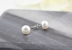 Minimalist white freshwater pearl stud earrings Details : - 8mm natural white freshwater pearls, roundelle Shape Pearls - Sterling silver The earrings will be packed in a jewelry gift box. Enter my main shop page: www.etsy.com/shop/vasanaa Thank you for visiting my shop. Minimalist White Pearl Earrings For Anniversary, Everyday White Round Pearl Earrings, Minimalist White Akoya Pearl Earrings, Gift White Round Beads Pearl Earrings, Gift White Pearl Earrings, White Round Beads Pearl Earrings Gift, Gift White Round Pearl Earrings, Hypoallergenic White Pearl Earrings With Round Beads, White Hypoallergenic Round Pearl Earrings