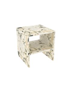 a white and black marble side table with an open shelf on the top, in front of a white background