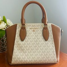 Michael Kors Signature Sienna Messenger Bag. Color Is Acorn/Vanilla, Retails For $278. Great Deal With Price!!! No Flaws And Still Has Tag Attached. Love This Purse I Just Want Something Bigger To Fit My Laptop In This Summer! Luxury Michael Kors Beige Satchel, Luxury Beige Michael Kors Satchel, Michael Kors Beige Satchel With Detachable Handle, Michael Kors Cream Satchel Shoulder Bag, Michael Kors Cream Shoulder Bag With Detachable Handle, Michael Kors Beige Shoulder Bag With Detachable Handle, Michael Kors Beige Rectangular Satchel, Luxury Cream Michael Kors Shoulder Bag, Michael Kors Cream Bag With Detachable Handle