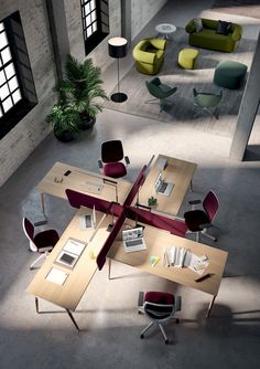 an overhead view of a modern office with multiple tables and chairs in the middle of it