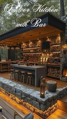 an outdoor bar is lit up at night with lights on the tables and stools