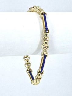 We present to your attention this stylish bracelet.  Experience the sophisticated elegance of the Italian Paperclip Enamel Link Chain Bracelet, crafted with the utmost precision from pure 14k Italian gold. The Blue color will suit any outfit, be it evening or everyday. This bracelet comes with an equally exquisite necklace. You can watch it at this link:  Be sure to click the heart button in the top right corner of the image to save it to your favorites or add it to your Wishlist's.😊 Regular cleaning and maintenance will preserve its beauty for years to come. Metal: 14k Solid Italian gold. Please ask me any questions you may have before making your purchase. Shipping: Your order will be professionally packed and shipped. US free shipping is for the 48 Continental states.  Return Policy: 3 Formal Blue Bracelet With Polished Finish, Blue Bracelets With Polished Finish For Formal Occasions, Modern Enamel Bracelets For Formal Occasions, Luxury Blue Gold Bracelet For Formal Occasions, Classic Blue Enamel Jewelry, Elegant Blue Gold Bracelet For Formal Occasions, Luxury Blue Gold Jubilee Bracelet, Blue Gold Bracelet With 17 Jewels For Formal Occasions, Classic Blue Round Gold Bracelet