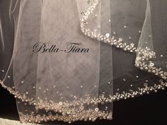 the back of a wedding dress with beading on it